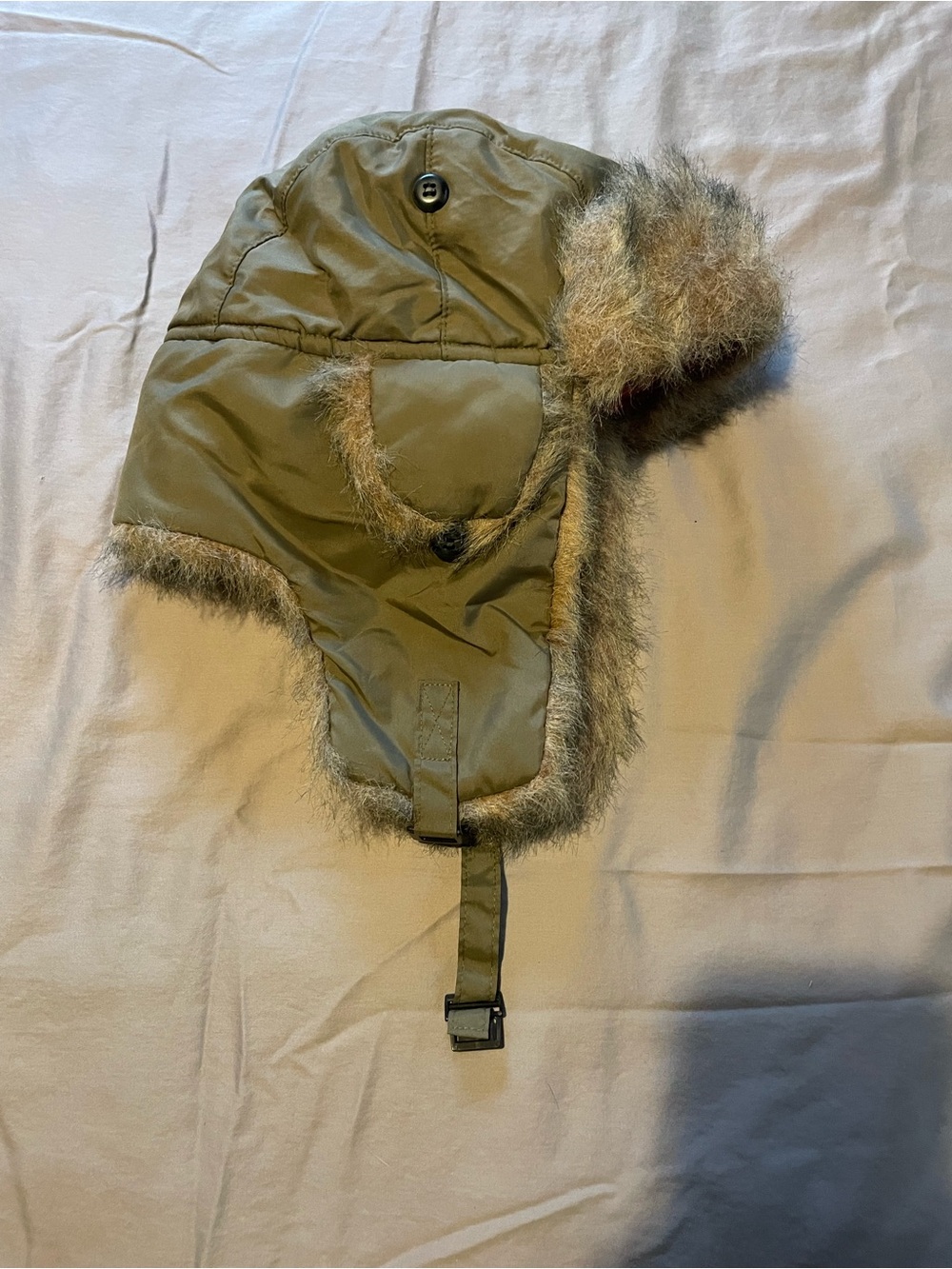 Green hat with faux fur Hunter orange inside.